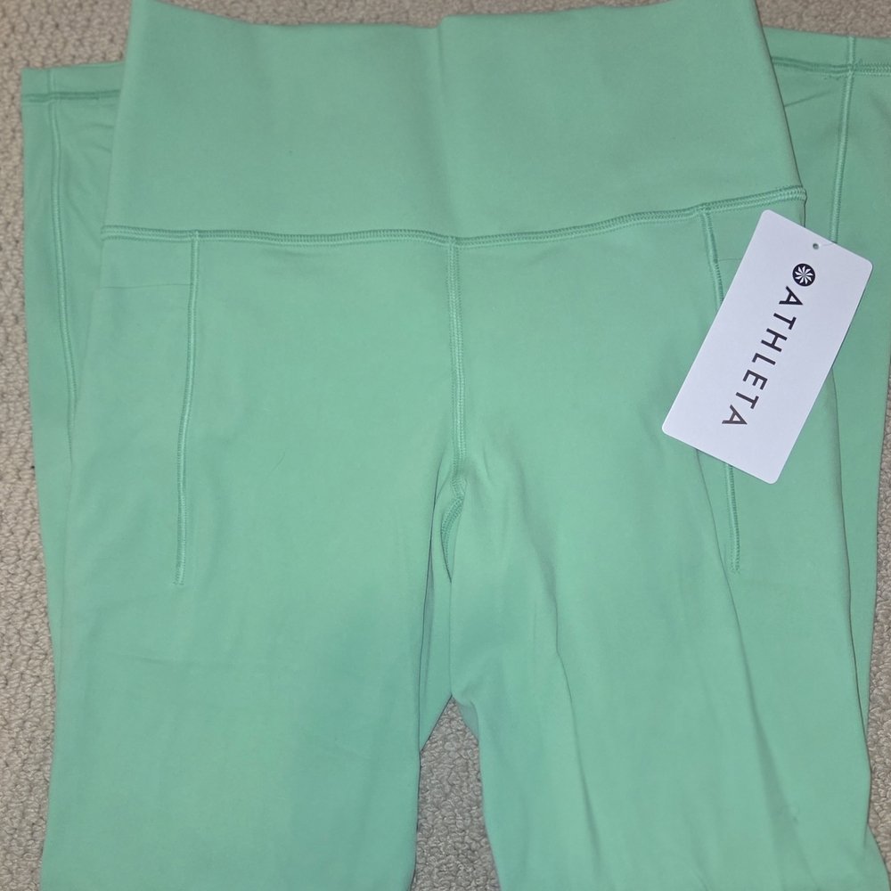 Athleta Salutation Stash Tight in Light Green